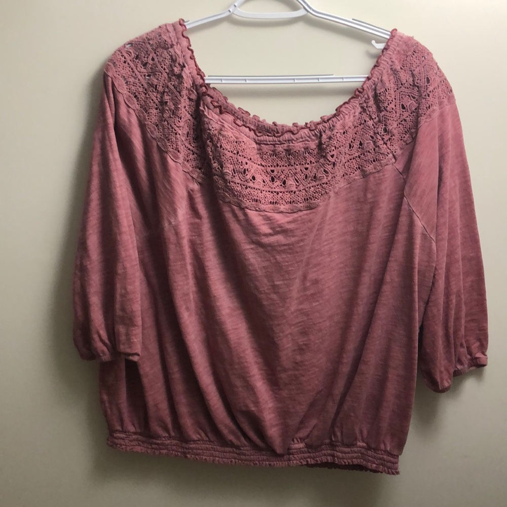 Pink blouse with lace design at collar